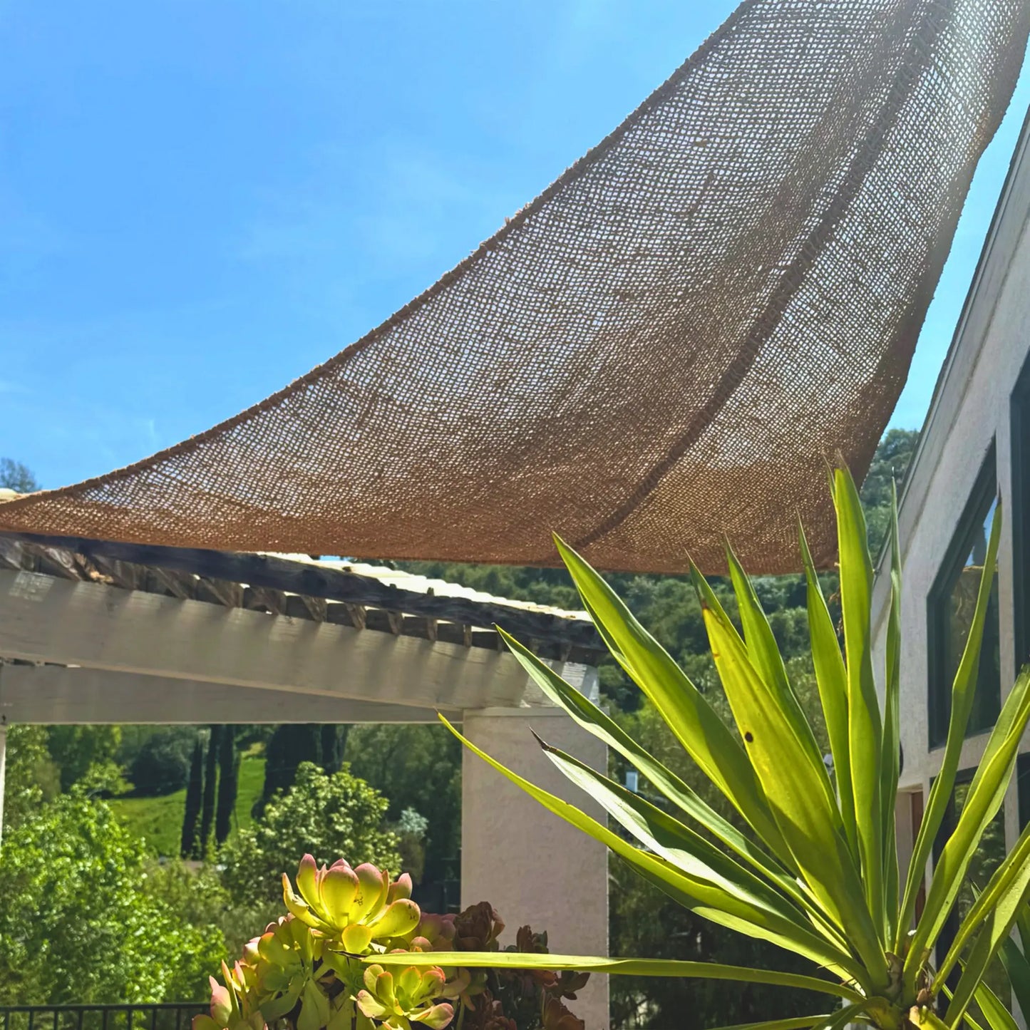 Natural shade sail and white pergola rustic  handwoven fibre made from coconut fibre breathable 