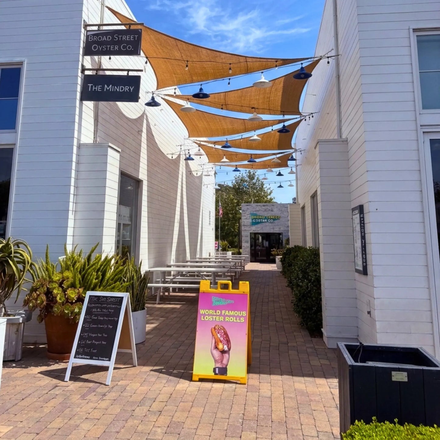 12' x 12' x 12' triangle coconut fibre shade sail natural fibers handmade artisan europe rustic vibes non toxic rooftop bar Malibu California coco du sol filtered dappled light breathable shade pattens broad st oysters